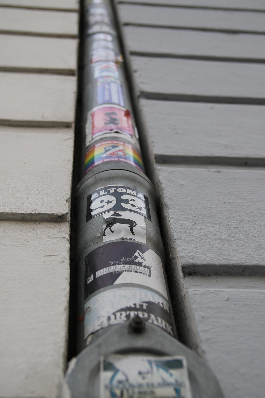 A rain gutter along a house roofline
