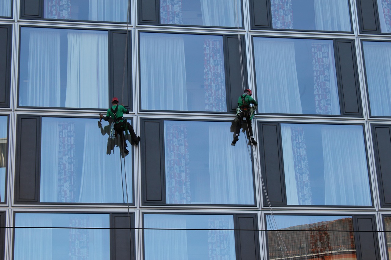 A commercial building having its windows cleaned